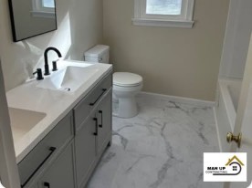 Remodeled bathroom vanity by Man Up Contracting