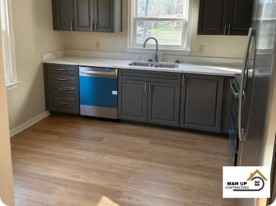 Remodeled kitchen by Man Up Contracting