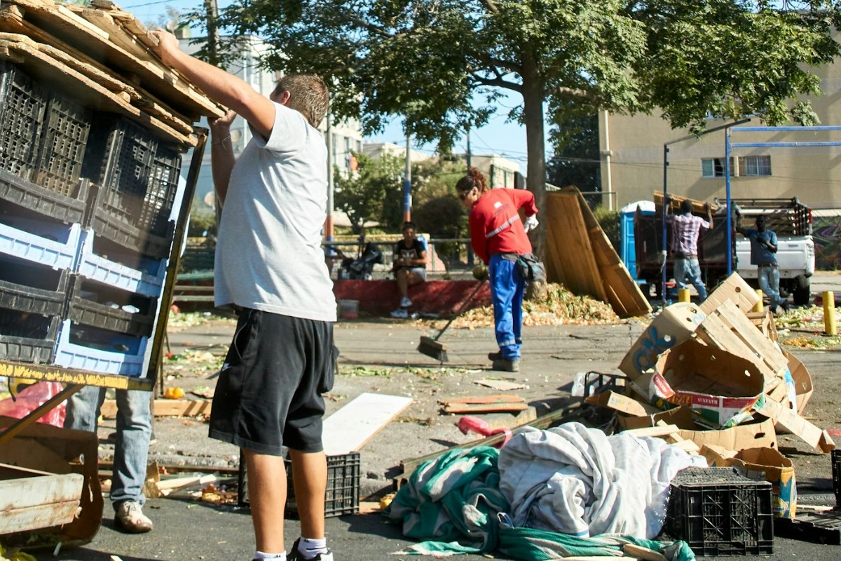 Relief volunteer clearing storm debris (stock photo)